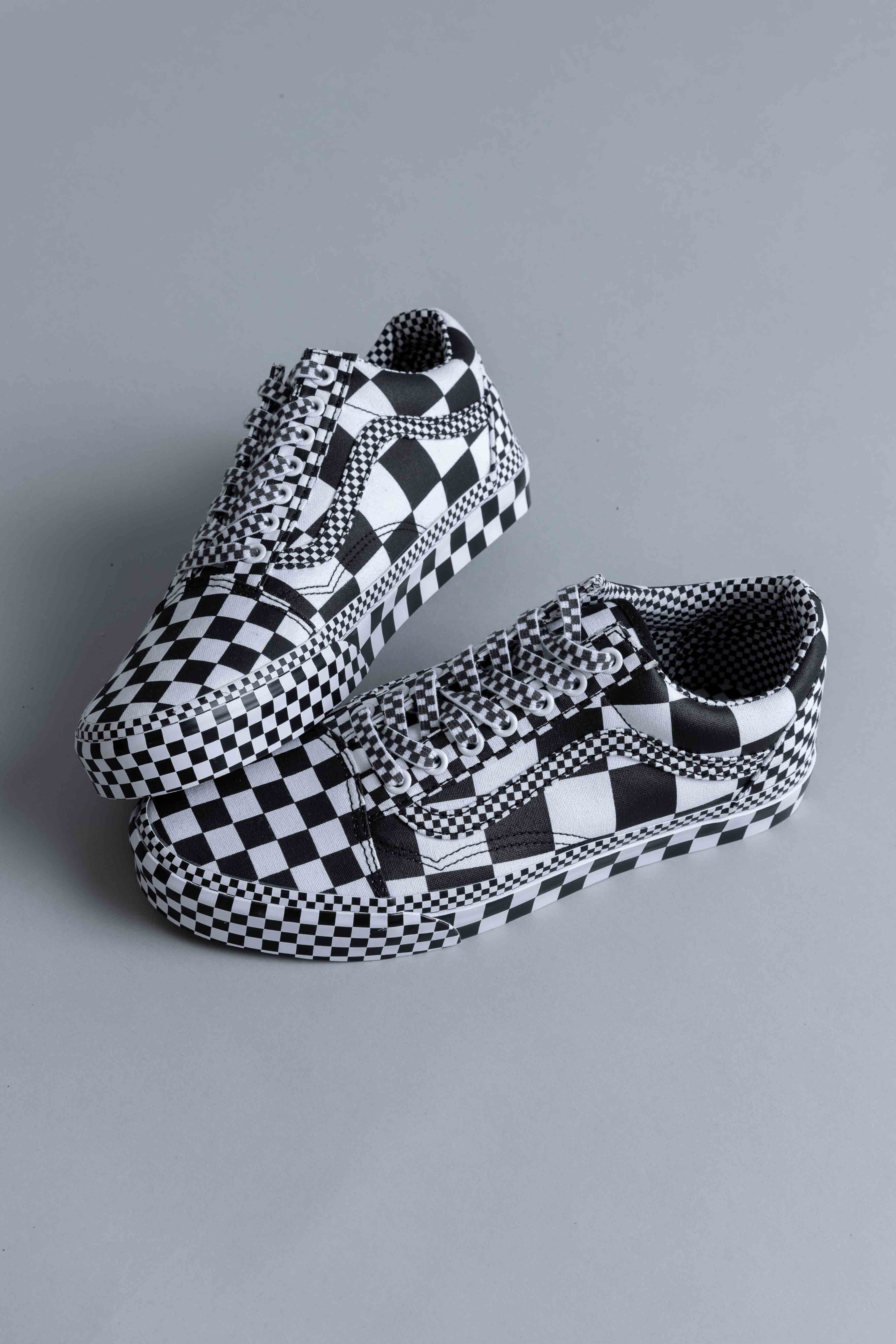 all over checkerboard vans slip on