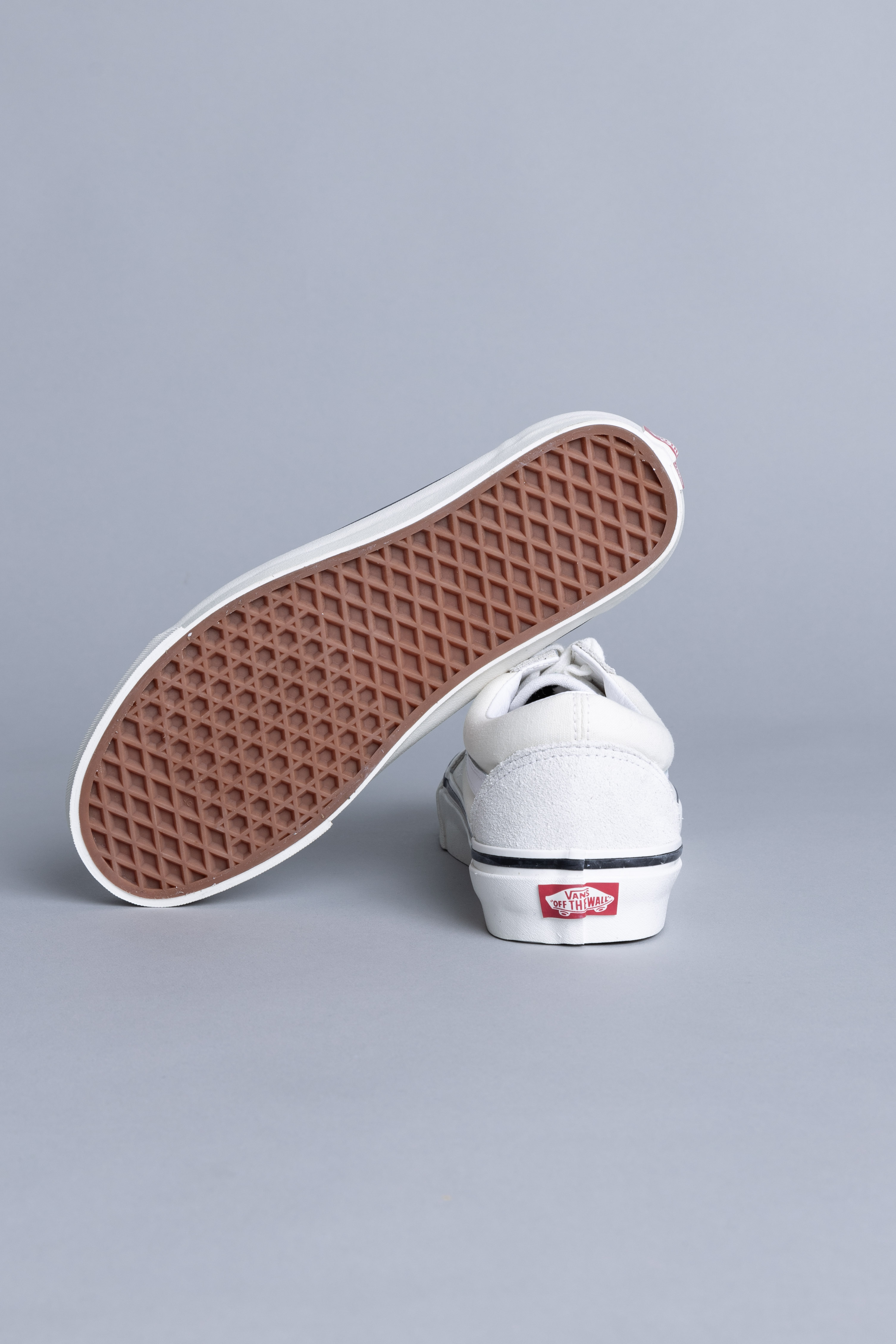 white and beige vans